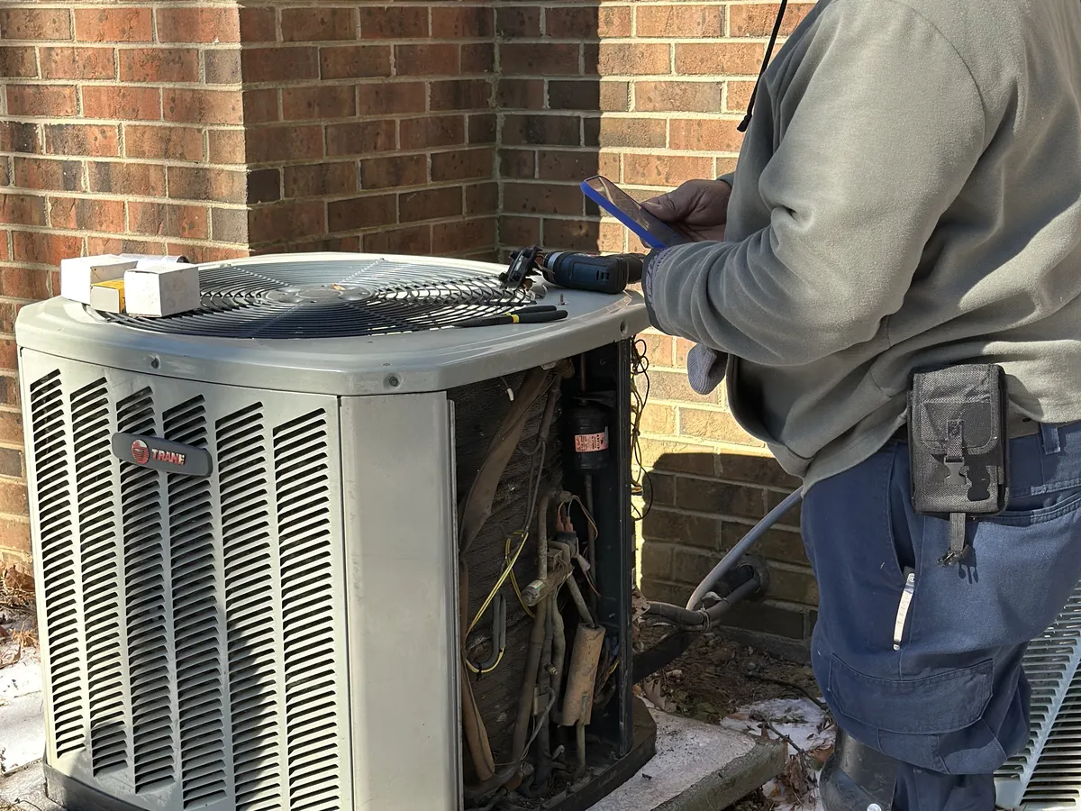 Outdoor AC condenser unit at a Raleigh NC home eligible for Energy Saver NC rebates